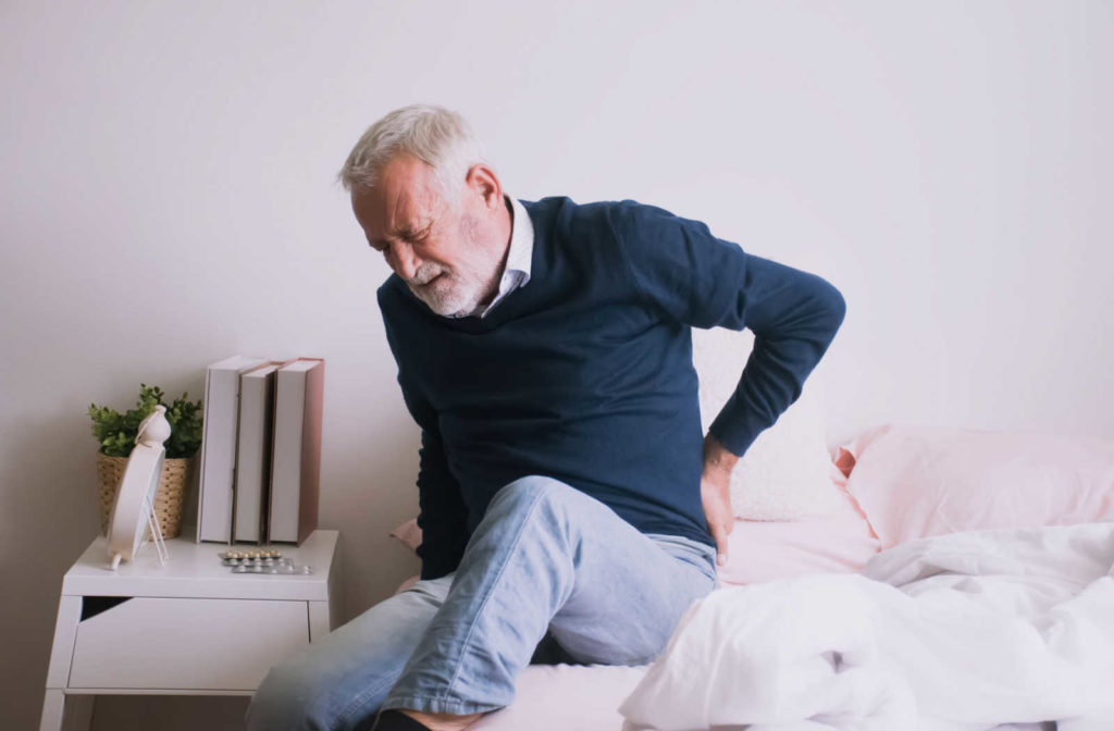 An older man suffering from hip pain.