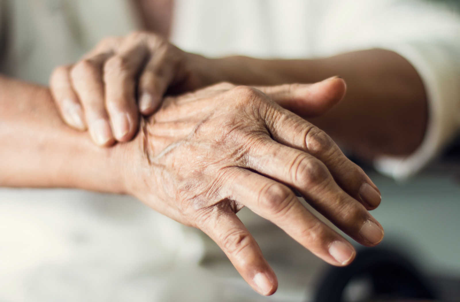 Close up of the hands of an individual with Parkinson's disease.