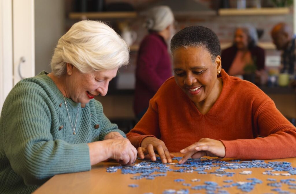 Two senior residents piece together a puzzle in their community.
